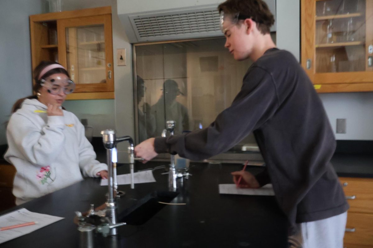 Joseph Ponton (11) and Piper Korstad (10), set up for their experiment.