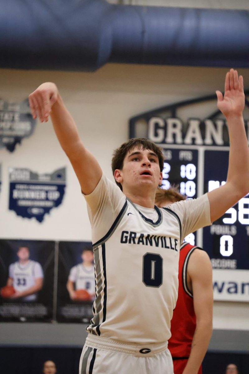 Senior Charlie Wright shoots a free throw. He watched to see the ball swish through the basket.
