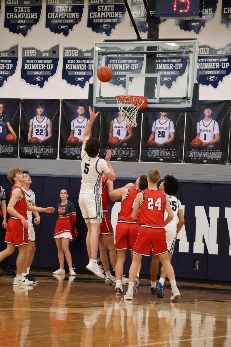Junior Frankie Annarino drives hard into the paint and elevates for a floater over the defense. This move resulted in a big possession that helped extend their lead in the final minutes.