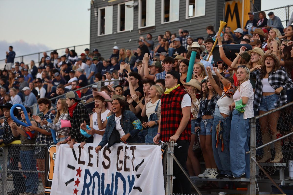The Deck gets rowdy for country night against Watkins Memorial. They help hype up the players. 