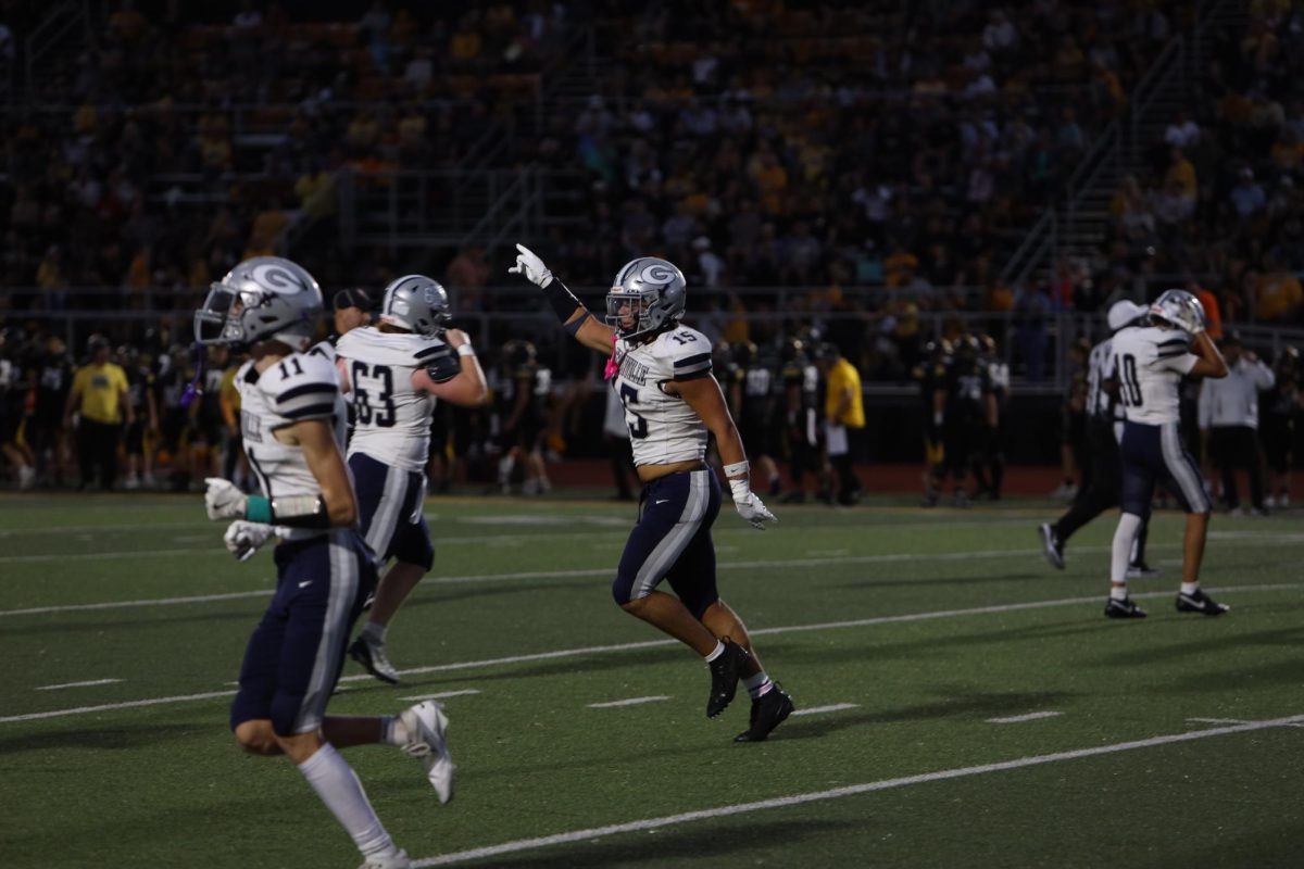 Senior Kyle Kirby dances back to the sidelines after scoring a Blue Aces touchdown. 