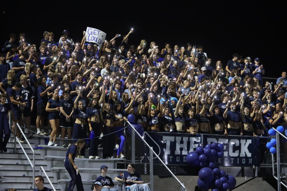 The Blue Aces student section The Deck lights up the night and gets loud. They dress in all blue for their homecoming game theme. 