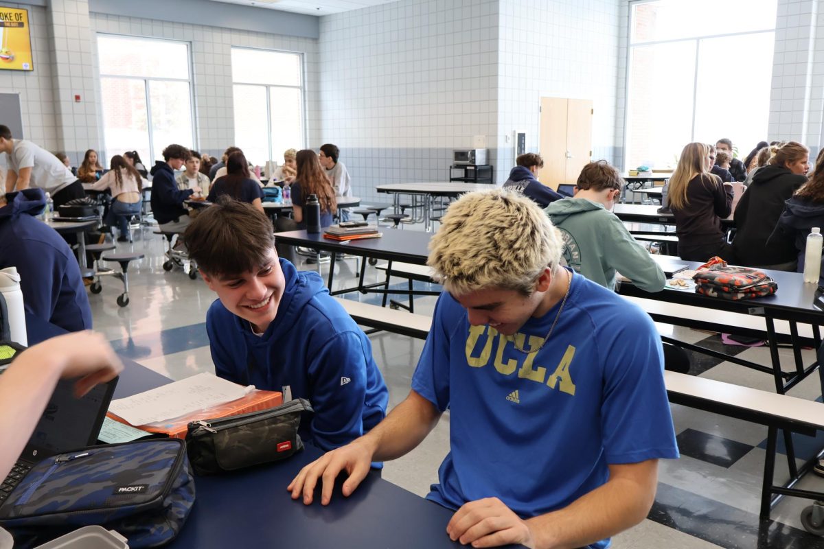 Sophomores Cooper Duncan and Philip Volgemier share a laugh together at lunch. The boys enjoyed their lunch together.