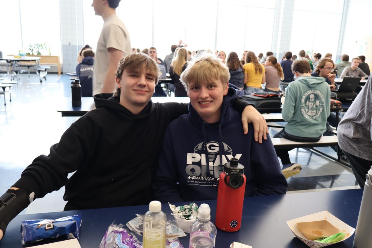 Sophomores Nate Gee and Liam Knuth smile big for the picture while they eat their lunch. The boys had a good lunch.