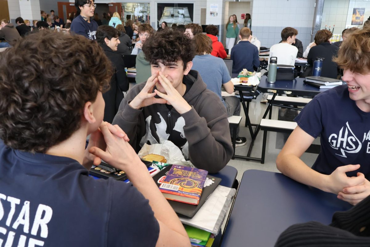 Jayden Hulse and Griffin Arundel joke around while they sit at lunch and try to act studious.