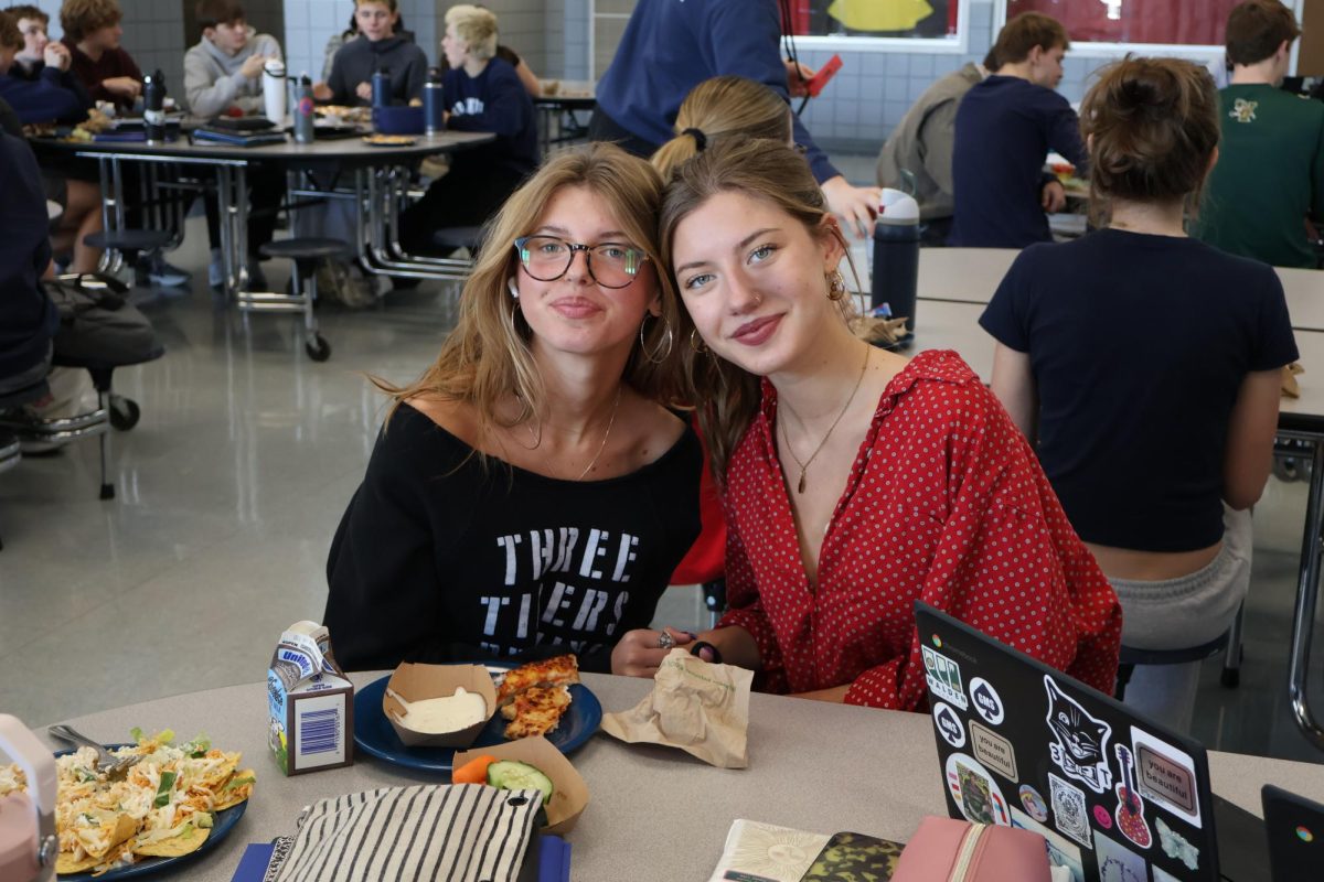 Sisters Emma and Clara Dandurand enjoy their lunch together. The two are inseparable!