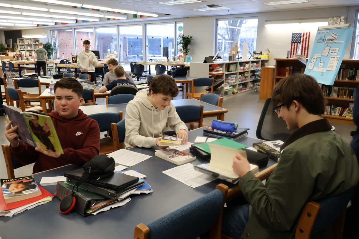 Freshman Jackson Smith, Crosby Spiker, and Noah Beaumont skim their sources in an attempt to gather needed research. There are many different types of sources that were available to the students.