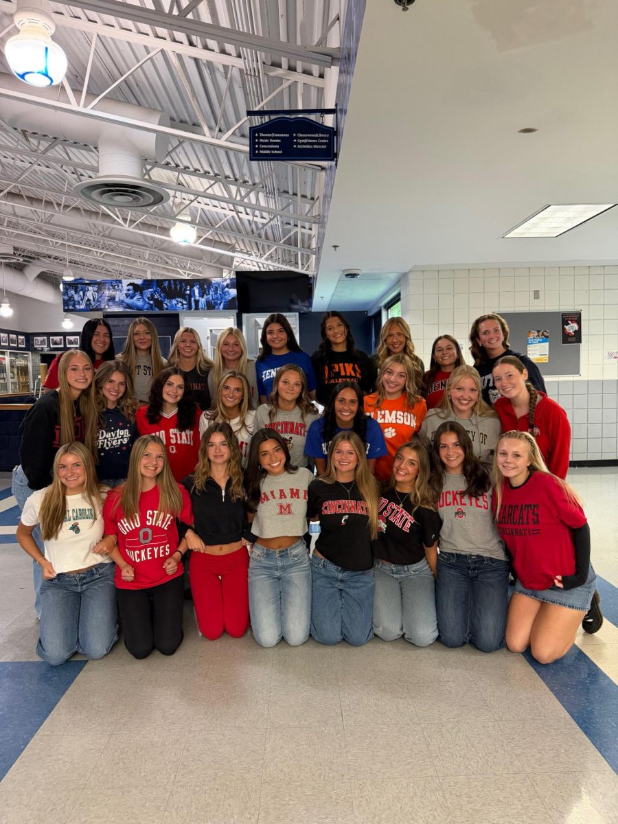 Senior girls gather together to take group photo on decision day.