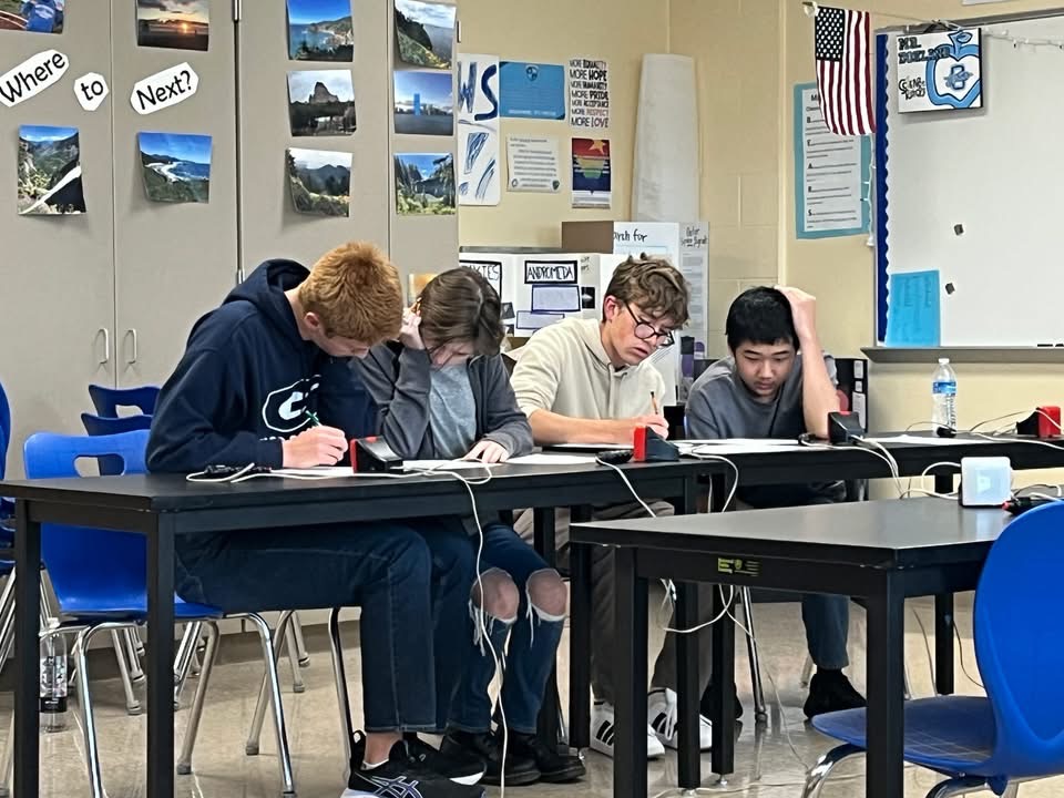 Academic Team members work hard to answer the questions. Photo courtesy Caleb Slavinski
