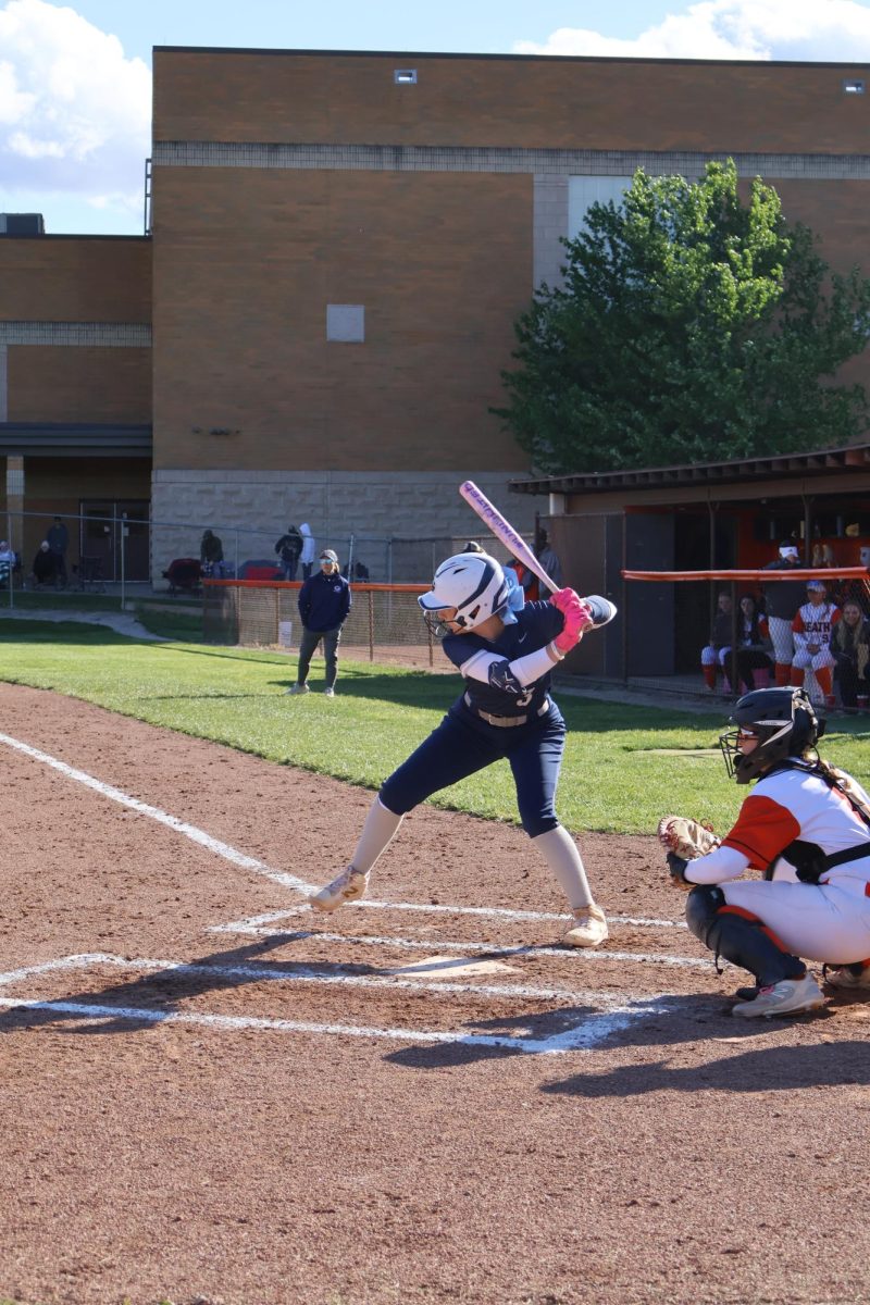 Sophmore Aubrey Lackey is powerful in the game and serves a ready position to attack the ball. She scored after this hit, after she sent the ball out of playing area and stepped on home plate.